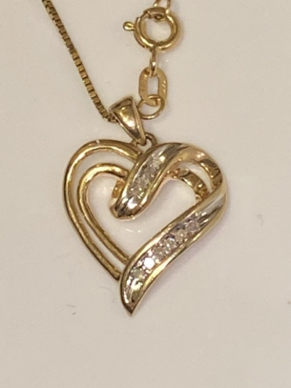 10K Solid Yellow Gold Diamond Ribbon Heart Pendant with Diamond Accents.